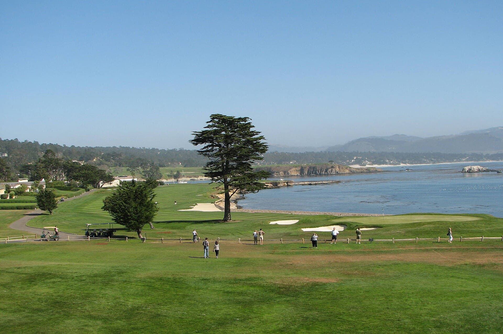 The iconic par-5 18th hole hugging the Pacific coastline at Pebble Beach Golf Links, Pebble Beach, CA.